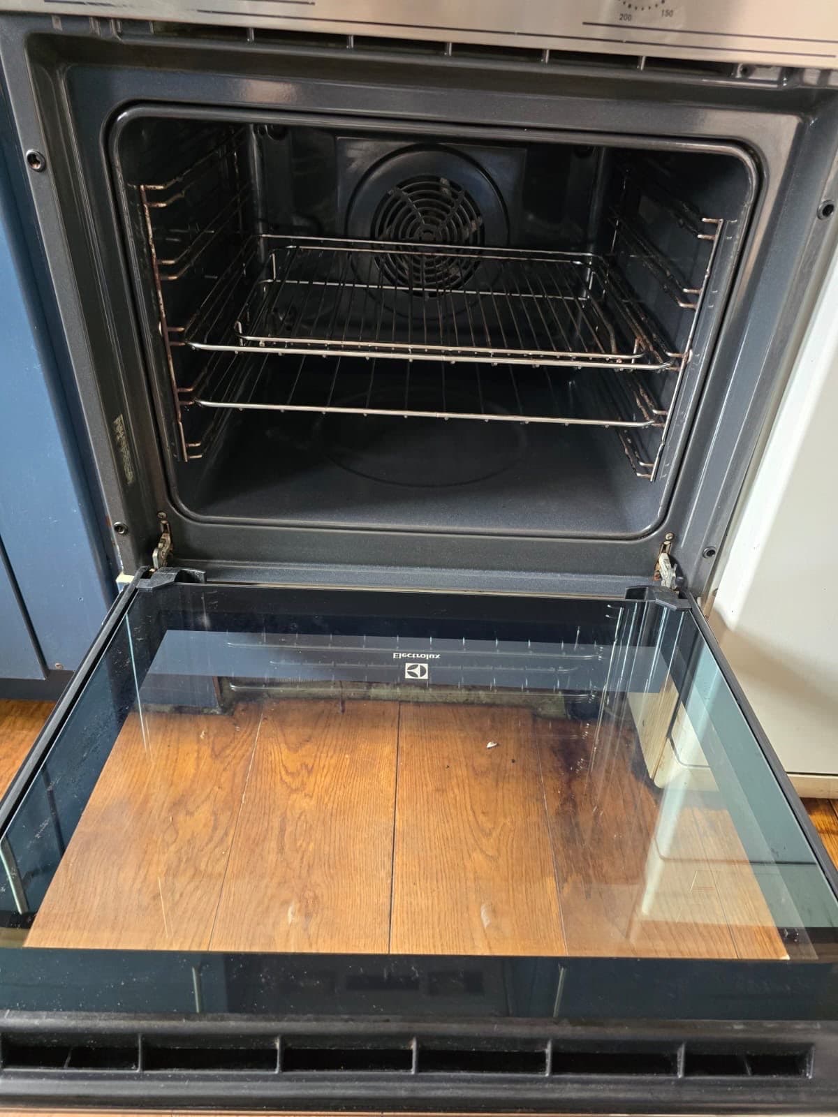 An oven cleaned back to bare metal and clear door glass