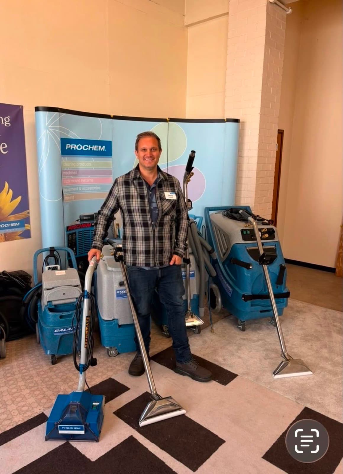 David Lindon at the Prochem training academy alongside professional carpet extraction machines